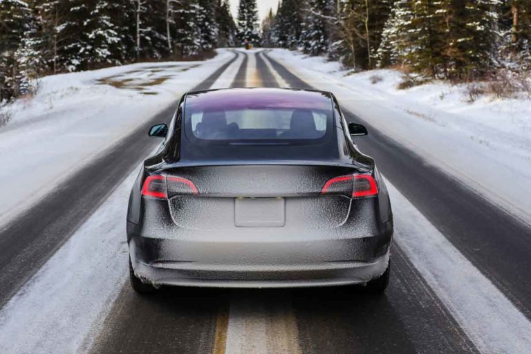 Black-Tesla-Driving-In-The-Snow