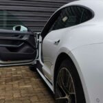 White-Porsche-Taycan-with-open-driver's-door
