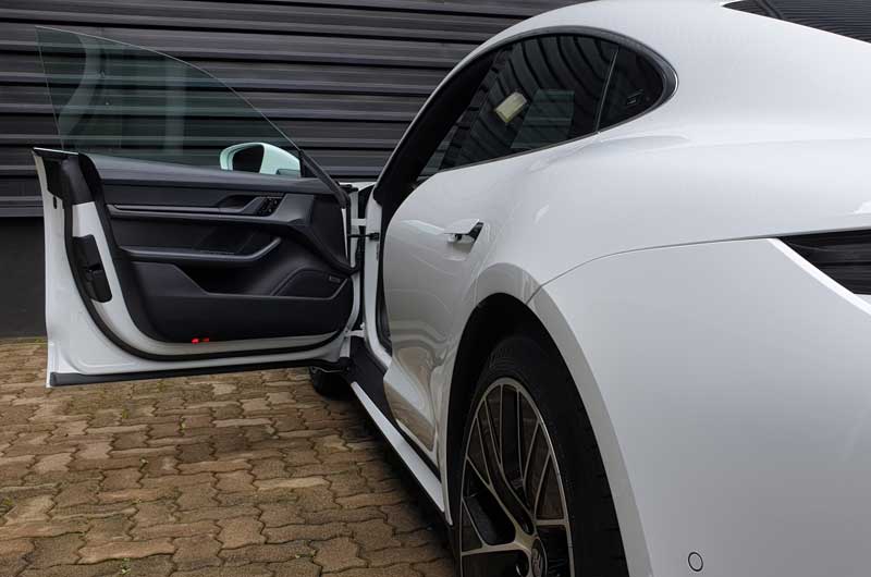White-Porsche-Taycan-With-Open-Driver'S-Door