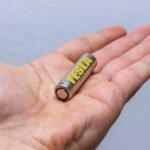 battery-tesla-in-person-in-hands
