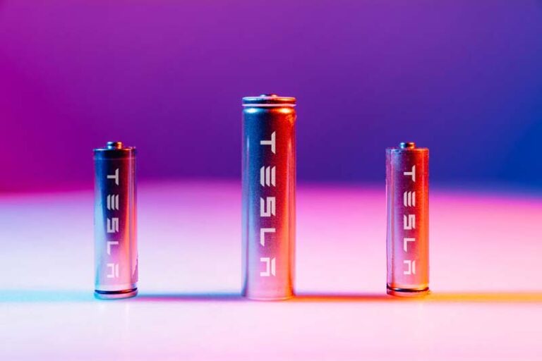 li-ion-silver-batteries-with-written-word-tesla-on-illuminated-by-multicolored-light