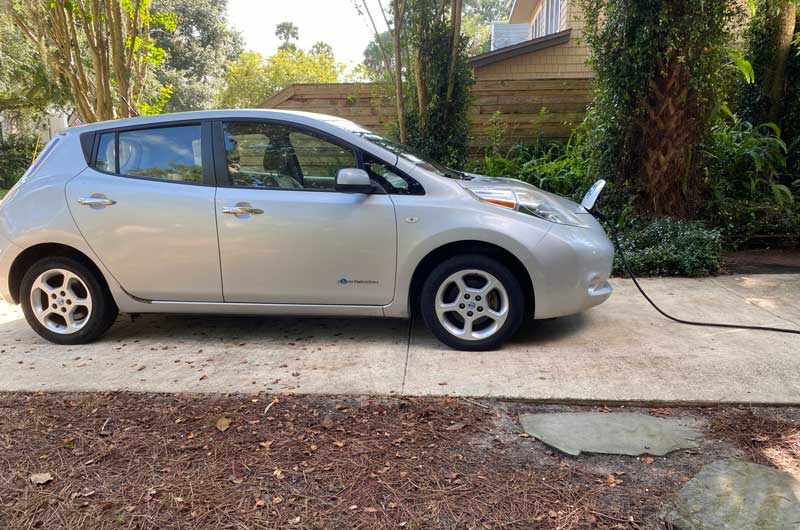 Nissan-Leaf-Charges-In-The-Driveway-Of-A-Home