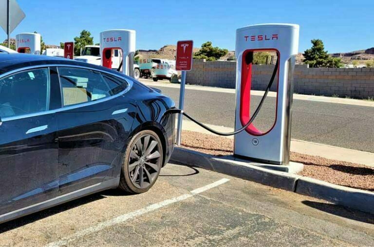 tesla-plugged-in-and-getting-an-electric-charge-at-the-supercharger