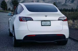 white-tesla-model-y-with-personalised-number-plate